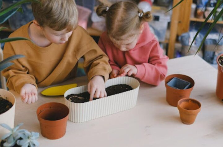 kids inspecting potted soil