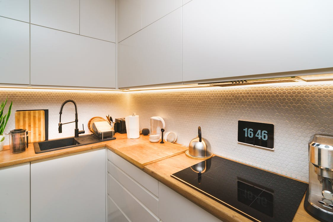 modern kitchen with digital clock and induction cooktop